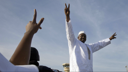 Gambian President Adama Barrow greets the crowds after arriving at Banjul airport in Gambia in January.
