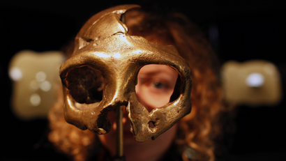 A girl looks through the replica of a neanderthal skull displayed in the new Neanderthal Museum in the northern town of Krapina February 25, 2010.