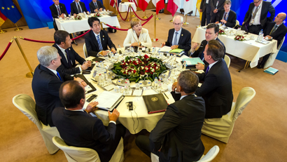Group of 7 leaders from front center right clockwise, U.S. President Barack Obama, French President Francois Hollande, Canadian Prime Minister Stephen Harper, Italian Prime Minister Matteo Renzi, Japanese Prime Minister Shinzo Abe, German Chancellor Angela Merkel, European Council President Herman Van Rompuy, European Commission President Jose Manuel Barroso and British Prime Minister David Cameron a G7 summit at the EU Council building in Brussels on Thursday, June 5, 2014. The leaders of the G-7 group of major economies center their effort during the concluding day of their summit on spurring growth and jobs in an attempt to reinforce a rebound from the global financial crisis. )