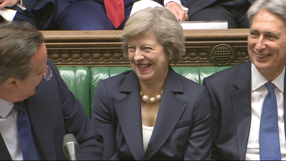Theresa May laughs with former prime minister David Cameron and Chancellor Philip Hammond