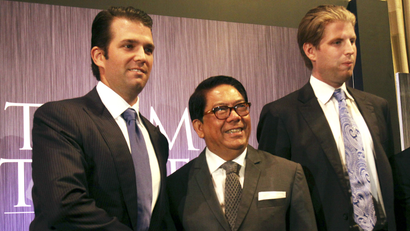Donald Trump Jr., left, and Eric Trump, right, sons of real estate developer Donald Trump, pose with local developer Jose E. B. Antonio during a press conference on the launching of Manila's Trump Tower project Tuesday, June 26, 2012 in the financial district of Makati, Philippines. The US$150-million, 56-story residential building using the brand name and mark under license from the New York-based Trump will be constructed by a local construction company.