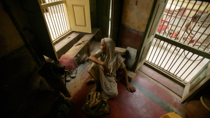 A woman rests in an old age home in the pilgrimage town of Vrindavan