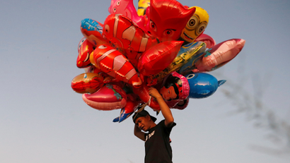 A man sells balloons in Manila
