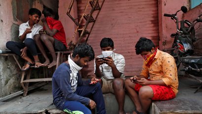 The Wider Image: Indians build their own lockdown barricades in the country's slums