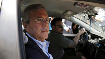 Republican presidential candidate Jeb Bush takes an Uber vehicle as he departs an appearance at Thumbtack, a consumer service connecting experienced professionals, in San Francisco, California July 16, 2015.