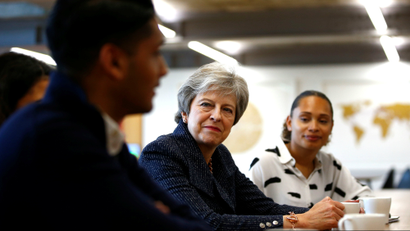 Britain's Prime Minister Theresa May talks to employees at WPP