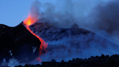 Italy's Mount Etna, Europe's tallest and most active volcano, spews lava as it erupts on the southern island of Sicily