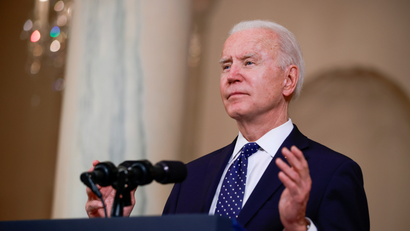 U.S. President Joe Biden speaks in the Cross Hall at the White House in Washington, U.S., April 20, 2021.