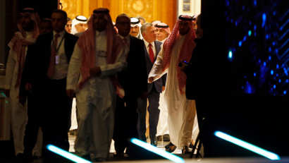 Jordan's King Abdullah II, center, enters the Future Investment Initiative conference hall, in Riyadh, Saudi Arabia, Tuesday, Oct. 23, 2018. The high-profile economic forum in Saudi Arabia is the kingdom's first major event on the world stage since the killing of writer Jamal Khashoggi at the Saudi Consulate in Istanbul earlier this month. (AP Photo/Amr Nabil)