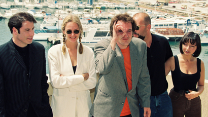 Actor John Travolta, actress Uma Thurman, American director Quentin Tarantino, actor Bruce Willis and actress Maria de Medeiros pose during a photocall for their film "Pulp Fiction" in competition at the 47th Cannes Film Festival