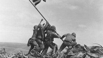 FILE - In this Feb 23, 1945 file photo, U.S. Marines of the 28th Regiment, 5th Division, raise the American flag atop Mt. Suribachi, Iwo Jima, Japan. The Marines Corps announced Thursday, June 23, 2016, that one of the six men long identified in the iconic World War II photograph was actually not in the image. A panel found that Private First Class Harold Schultz, of Detroit, was in the photo and that Navy Pharmacist's Mate 2nd Class John Bradley wasn't in the image. Bradley had participated in an earlier flag-raising on Mount Suribachi. (AP Photo/Joe Rosenthal, File)