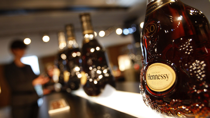 A customer looks at bottles of Hennessy X.O at the Hennessy factory in Cognac