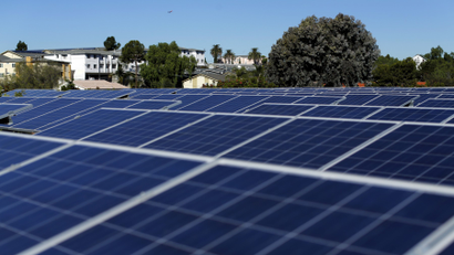 Solar panels are shown on top of a Multifamily Affordable Solar Housing-funded (MASH) housing complex in National City, California..