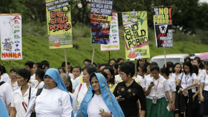Catholic nuns and students take part in an anti-child pornography rally in Manila November 19, 2008. The group was asking the government for legislation to criminalize child pornography.