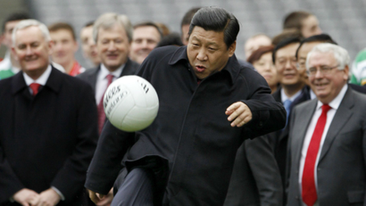 China's Vice-President Xi Jinping kicks a football during a visit to Croke Park in Dublin, Ireland February 19, 2012.