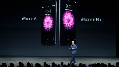 Apple CEO Tim Cook with the iPhone 6 and iPhone 6 Plus