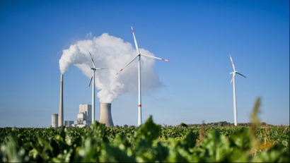 The coal power plant Mehrum and wind turbines producing energy in Hohenhameln, Germany