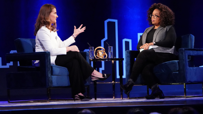Melinda Gates speaks to Oprah Winfrey on stage during a taping of her TV show in the Manhattan borough of New York City
