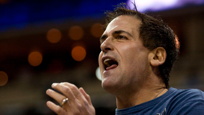 Dallas Mavericks team owner Mark Cuban cheers on his team against the Charlotte Bobcats during an NBA basketball game in Charlotte