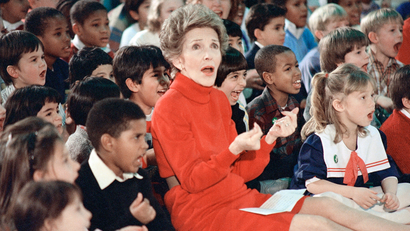 FILE - In this Feb. 26, 1987 file photo, then first lady Nancy Reagan watches an anti-drug musical titled "Just Say No," performed by teenage students from the Chantilly, Va., High School Drama Department at the Cameron Elementary School in Alexandria, Va. Reagan, who died Sunday, March 6, 2016, is perhaps best known for her "Just Say No" to drugs and alcohol campaign. Three decades after the campaign's heyday, prevention experts credit it with spawning a new generation of research into the best ways of reducing drug abuse. But they also say that many of the fear-based tactics it embraced didn't work. (AP Photo/Scott Stewart, File)