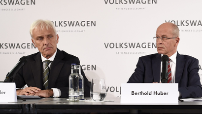 New Volkswagen CEO Matthias Mueller, Berthold Huber (2nd L) acting head of the Supervisory board of Volkswagen