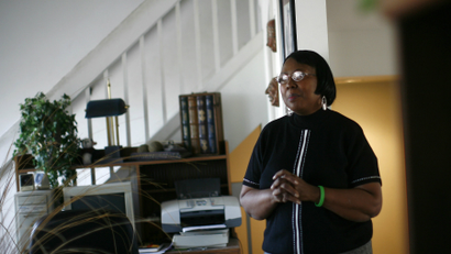 Lorene Parker pictured as she stood in her house, which fell into foreclosure, in Detroit, Michigan, in 2008.