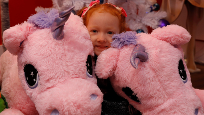 Aston Robertson-Jeyes, 3, plays with Unice Unicorn, at the launch of Hamleys top Christmas toys launch in London