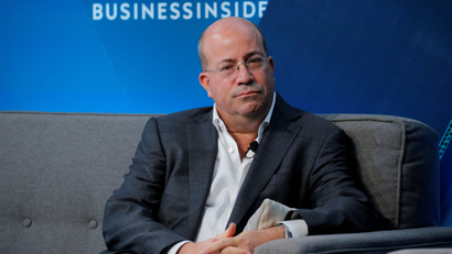 CNN president Jeff Zucker speaks in front of a blue background with the Business Insider logo above.