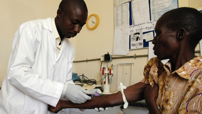 Woman is tested for HIV at an AIDS clinic in Kampala