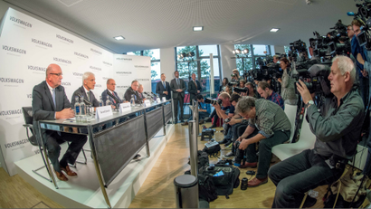 (L-R) Bernd Osterloh, works council chairman at Volkswagen; Matthias Mueller, the new chief executive of Volkswagen AG; Bernd Huber, chairman of the supervisory board; Stephan Weil, minister president of Lower Saxony; and Wolfgang Porsche, member of the supervisory board, attend a press conference at the VW factory in Wolfsburg, Germany, 25 September 2015.