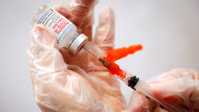 A healthcare worker prepares a syringe with the Moderna Covid-19 Vaccine at a pop-up vaccination site operated by SOMOS Community Care during the Covid-19 pandemic in Manhattan