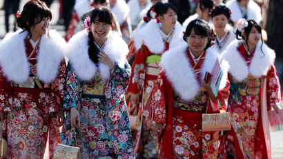 Japanese women wearing kimonos attend their Coming of Age Day celebration ceremony at Toshimaen amusement park in Tokyo