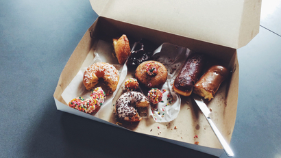 A box of half-eaten donuts and pastries