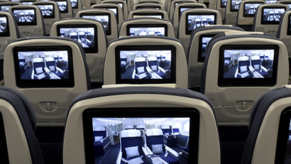 TV screens, installed on board of an Airbus A350 XWB flight-test aircraft are pictured during a media-day at the German headquarters of aircraft company Airbus in Hamburg-Finkenwerder