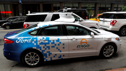 An Argo Ai self driving prototype vehicle is seen outside a Ford and Volkswagen joint news conference in New York City.