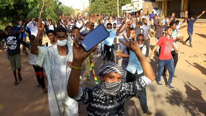 Sudanese demonstrators chant slogans as they march along the street during anti-government protests in Khartoum, Sudan December 25, 2018.