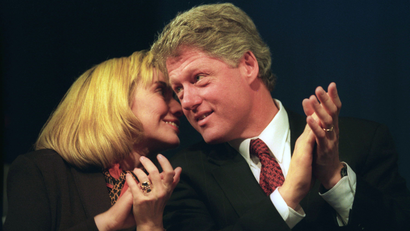 Hillary Clinton whispers to Bill Clinton during a campaign rally in 1993.