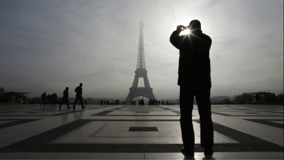 man and eiffel tower