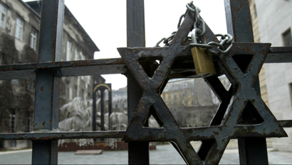 Star of David with a chain padlock hangs on front of a the largest Synagogue in Budapest.