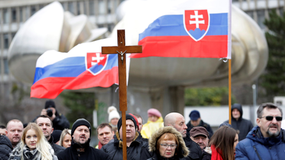 Marian Kotleba attends a march with Christian crosses and Slovakian flags