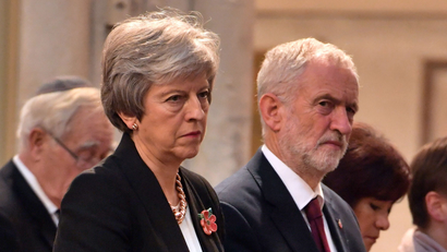 Britain's Prime Minister, Theresa May, and the leader of opposition Labour Party, Jeremy Corbyn attend an Armistice remembrance service at St Margaret's Church in London