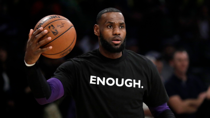 Los Angeles Lakers' LeBron James wears a t-shirt for the 12 victims of Wednesday night's shooting at a bar in Thousand Oaks, Calif., before an NBA basketball game against the Atlanta Hawks Sunday, Nov. 11, 2018, in Los Angeles.