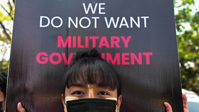 A woman takes part in a protest against the military coup at the University of Yangon, in Yangon, Myanmar, February 25, 2021