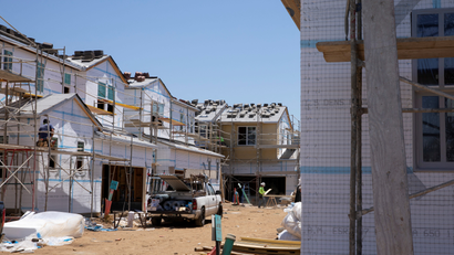 Residential single family homes construction by KB Home are shown under construction in the community of Valley Center, California.