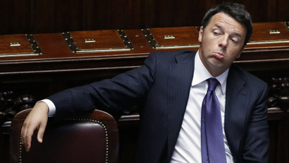 Italy's Prime Minister Matteo Renzi sits after delivering his speech at the Italian Parliament in Rome.