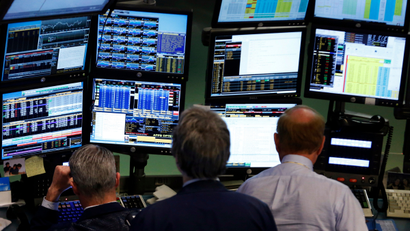 Traders work at Bloomberg terminals on the floor of the New York Stock Exchange, May 13, 2013. Bloomberg LP customers, including the U.S. Federal Reserve and the U.S. Treasury, are examining whether there could have been leaks of confidential information, even as the media company restricted its reporters' access to client data and created a position to oversee compliance in a bid to assuage privacy concerns. Bloomberg has more than 315,000 terminal subscribers globally, with each Bloomberg terminal costing more than $20,000 a year.