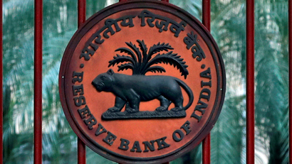 FILE PHOTO: FILE PHOTO: Reserve Bank of India logo is seen at the gate of its office in New Delhi
