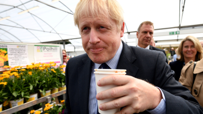 UK prime minister Boris Johnson with a drink