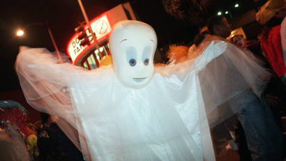 An unidentified Halloween reveler dressed as Casper the Friendly Ghost parades down Santa Monica Boulevard in West Hollywood, Calif., Tuesday, Oct. 31, 1995, during the city's annual Halloween parade The street was closed as thousands of party goers and onlookers walked in and out of costume. (AP Photo/Rene Macura)