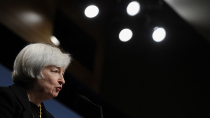 Federal Reserve Chair Janet Yellen speaks at the International Monetary Fund in Washington, Wednesday, July 2, 2014. Yellen said she doesn't see a need for the Fed to start raising interest rates to address the risk that extremely low rates could destabilize the financial system. (AP Photo/Susan Walsh)